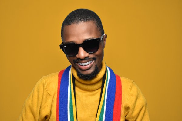 Black man wearing glasses in a studio