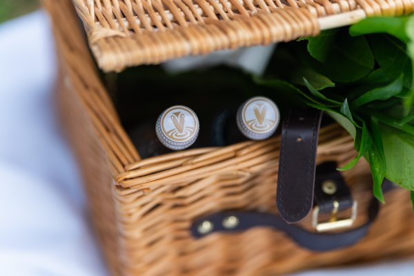 Valpre water bottles inside a cute basket with flowers
