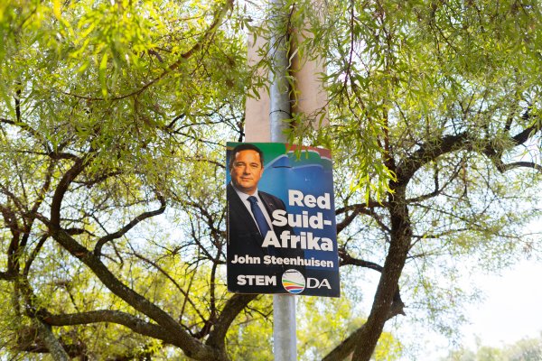 Vote DA sign on a pole amongst trees